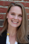 Woman with brown hair smiles